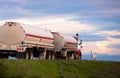 Stylish classic red semi truck with large cylindrical tanks