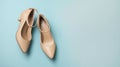 Stylish classic womens beige leather shoes with medium high heels, side shot on pink blue multi-colored paper. AI Generative