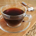 Glass mug of steaming Hot Coffee