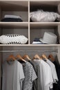 Stylish clothes and home stuff in large wardrobe Royalty Free Stock Photo