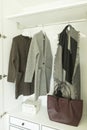 Stylish clothes and home stuff in wardrobe closet. Royalty Free Stock Photo