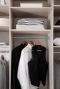 Stylish clothes and home stuff in large wardrobe Royalty Free Stock Photo