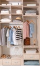 Stylish clothes, shoes and home stuff in large wardrobe Royalty Free Stock Photo