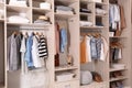 Stylish clothes, shoes and home stuff in large wardrobe Royalty Free Stock Photo