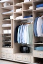 Stylish clothes, shoes and home stuff in wardrobe closet Royalty Free Stock Photo