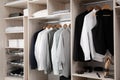 Stylish clothes, shoes and home stuff in large closet Royalty Free Stock Photo