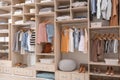 Stylish clothes, shoes and home stuff in large wardrobe Royalty Free Stock Photo