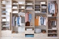 Stylish clothes, shoes and home stuff in large wardrobe Royalty Free Stock Photo