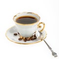 Stylish coffee cup with silver spoon and seed