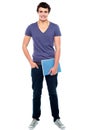 Stylish college student posing with notebook Royalty Free Stock Photo