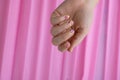 Stylish colorful summer female nails on pink background. Modern trendy stylish Beautiful manicure. Cute pastel nail