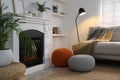 Stylish comfortable poufs near sofa in room. Home design Royalty Free Stock Photo