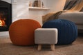 Stylish comfortable poufs near sofa in room. Home design Royalty Free Stock Photo