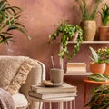 Stylish composition of creative spacious living room interior with plants, beige sofa, coffee table and stylish accessories. Royalty Free Stock Photo