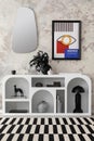 Stylish composition of living room interior with mock up poster frame, modern commode, patterned carpet, mirror, round vase and