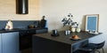 Stylish composition of modern small kitchen interior. Black furniture, workspace and dining space.