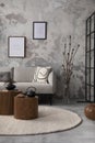 The stylish compostion at living room interior with design gray sofa, coffee table, plant, hanger, lamp and elegant personal Royalty Free Stock Photo