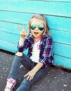 Stylish cool child wearing a sunglasses and checkered shirt