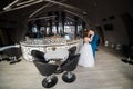 Stylish couple dancing, kissing in the modern interior of restaurant. Royalty Free Stock Photo