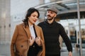 Stylish couple enjoying a casual walk in the urban landscape. Royalty Free Stock Photo