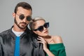 stylish couple posing in sunglasses for fashion shoot Royalty Free Stock Photo