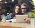 Stylish couple with tablet