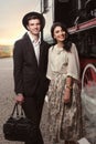 Stylish couple on vintage railway station Royalty Free Stock Photo