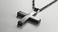 a stylish cross pendant necklace in a realistic photo, highlighting its timeless elegance and versatility as a fashion