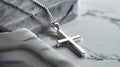 a stylish cross pendant necklace in a realistic photo, highlighting its timeless elegance and versatility as a fashion