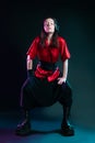 Stylish and daring image, futuristic fashion. A young woman in a multicultural outfit mixing Asian and European style.