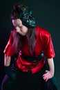 Stylish and daring image, futuristic fashion. A young woman in a multicultural outfit mixing Asian and European style.