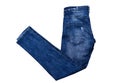 Stylish denim folded pants on white background close up