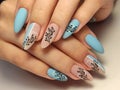 Stylish design of manicure on beautiful nails Royalty Free Stock Photo