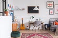 Stylish desk and chair in workspace in vintage kid room Royalty Free Stock Photo