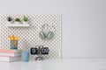 Stylish desk interior with White table background with plant and leaves. Modern home office interior Royalty Free Stock Photo