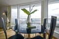 Stylish dining area with round glass top table