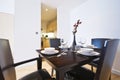 Stylish dining area with set up for four