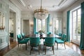 Stylish dining room interior with table surrounded by soft green armchairs and an elegant chandelier. Art deco style
