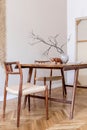 Stylish dining room in japandi interior design style. Royalty Free Stock Photo