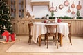 Interior design scandinavian wooden kitchen with round table and chairs. Stylish dining room in rustic style. Royalty Free Stock Photo