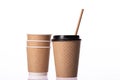 Stylish disposable brown paper cups small and medium sizes on white background Royalty Free Stock Photo