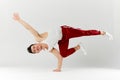 Asian personal break dancer trainer doing handstand on white background