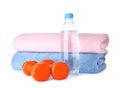 Stylish dumbbells, bottle of water and towels. Home fitness Royalty Free Stock Photo