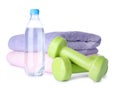 Stylish dumbbells, bottle of water and towels. Home fitness Royalty Free Stock Photo