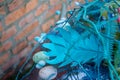 Stylish easter bouquet in blue tones over brick wall background, selective focus, copy space Royalty Free Stock Photo