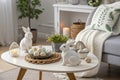 Stylish Easter Coffee Table with Ceramic Rabbits, Decorative Eggs, and Scandinavian Charm Royalty Free Stock Photo