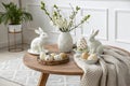 Stylish Easter Coffee Table with Ceramic Rabbits, Decorative Eggs, and Scandinavian Charm Royalty Free Stock Photo