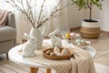 Stylish Easter Coffee Table with Ceramic Rabbits, Decorative Eggs, and Scandinavian Charm Royalty Free Stock Photo