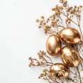 Stylish Easter gold eggs with golden dried flax linum bunch, white background