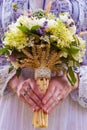 Stylish eclectic wedding bouquet in the bride hands